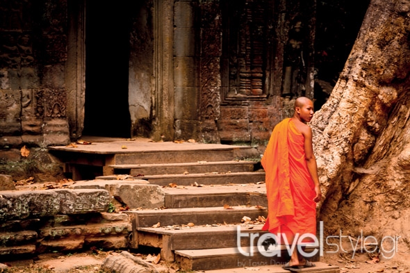shutterstock_107576144_siem-reap-cambodia-december-unidentified-monk-enters-an-ancient-temple-at-the-most-visited